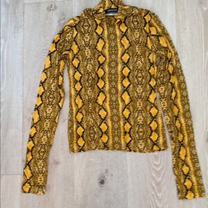 Andamane Beth snake-print turtleneck top in yellow